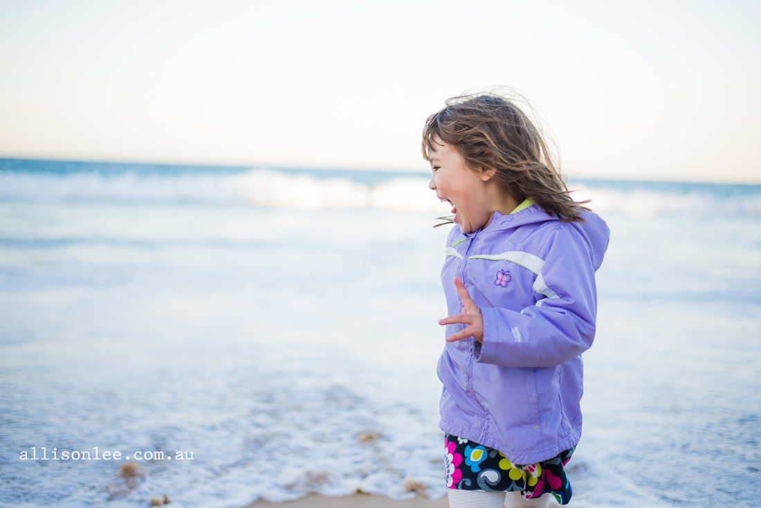 Four year old girl at the beach in winter