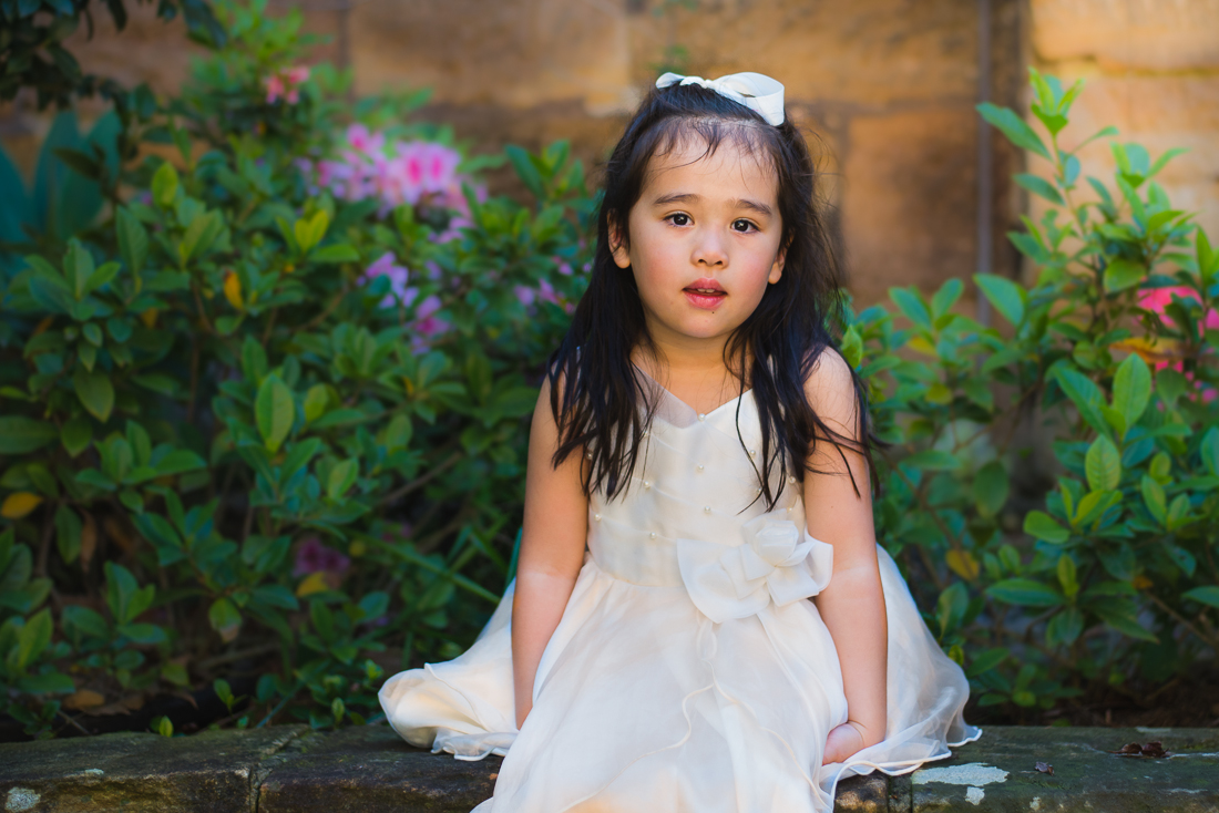 Beautiful brown haired four year old christening portrait