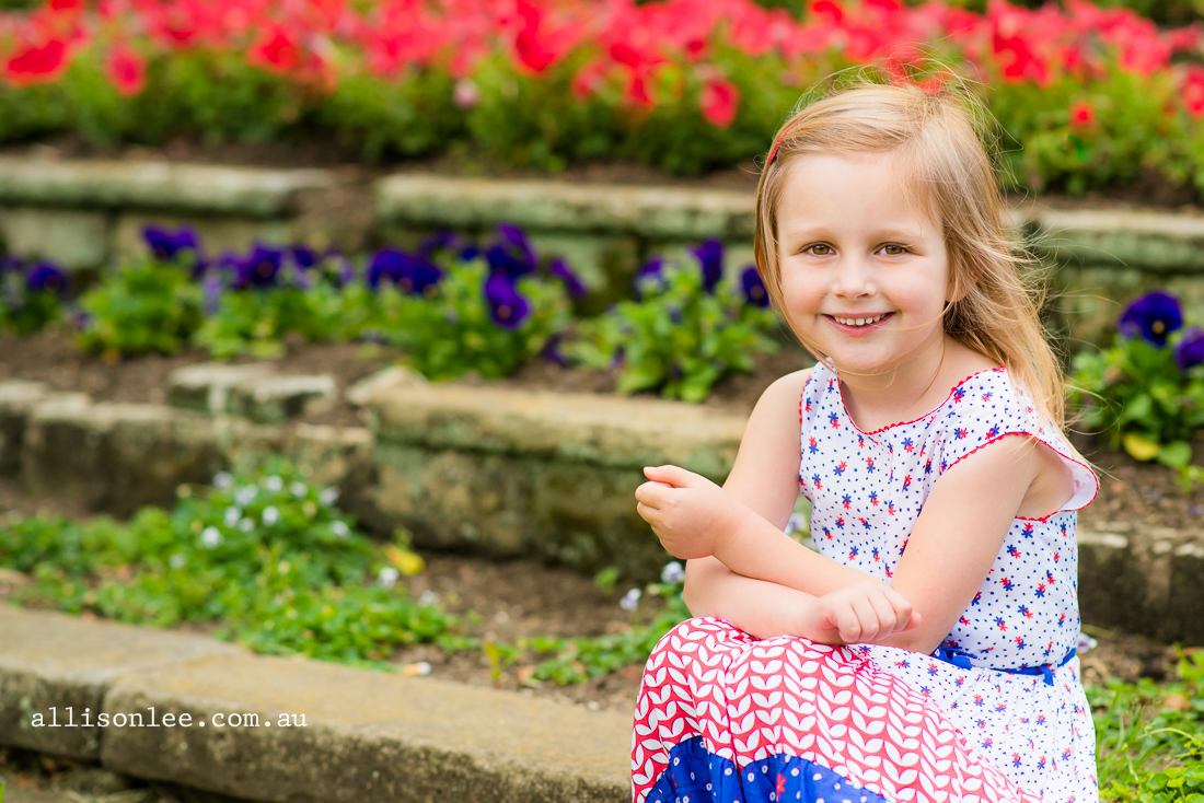 Portrait of four year old girl with flowers