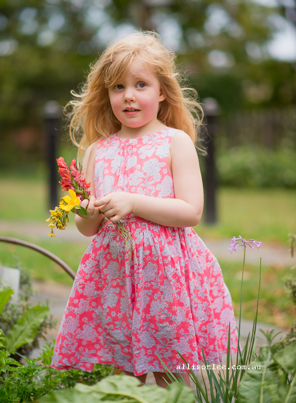 Blonde four year old picking flowers in Pyrmont