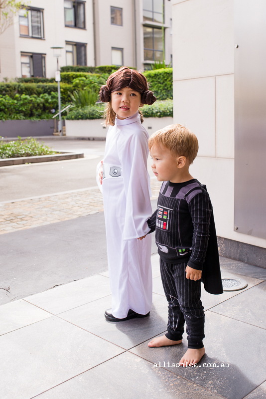 Boy and girl dresses as Princess Leia and Darth Vader