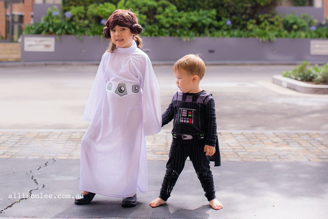 siblings playing dress up from star wars