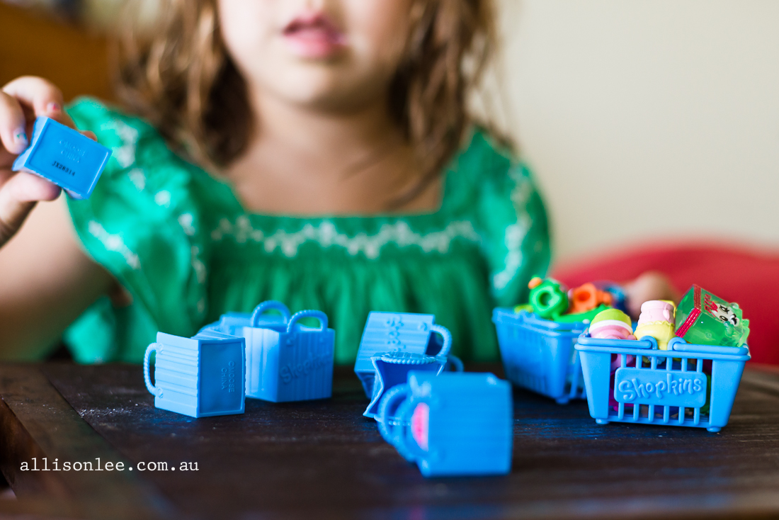 girl playing with shopkins