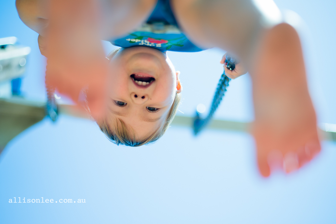 toddler swinging in the park