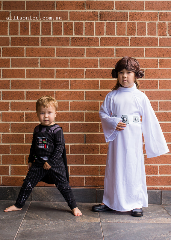 Siblings dressed as Darth Vader and Princess Leia