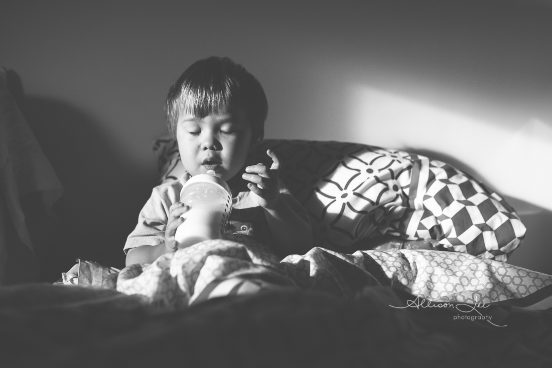 little boy resting drinking bottle