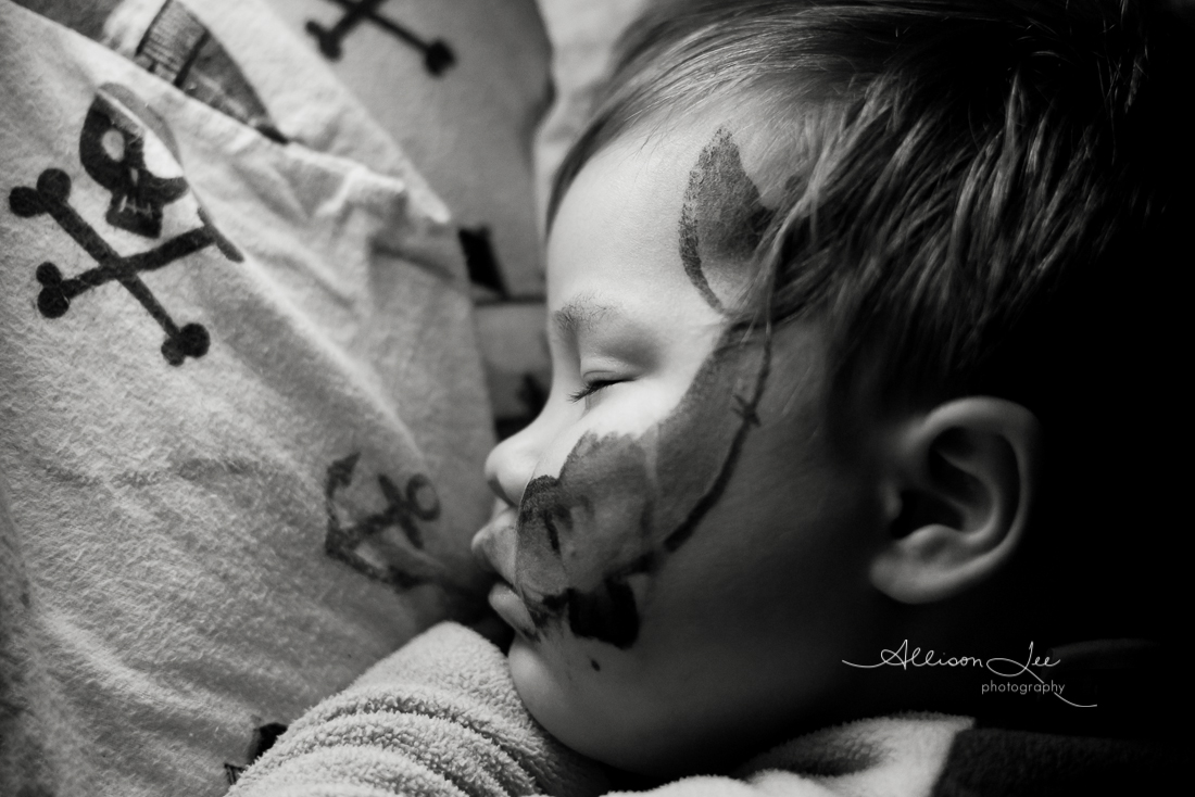 sleeping child with face paint child portrait